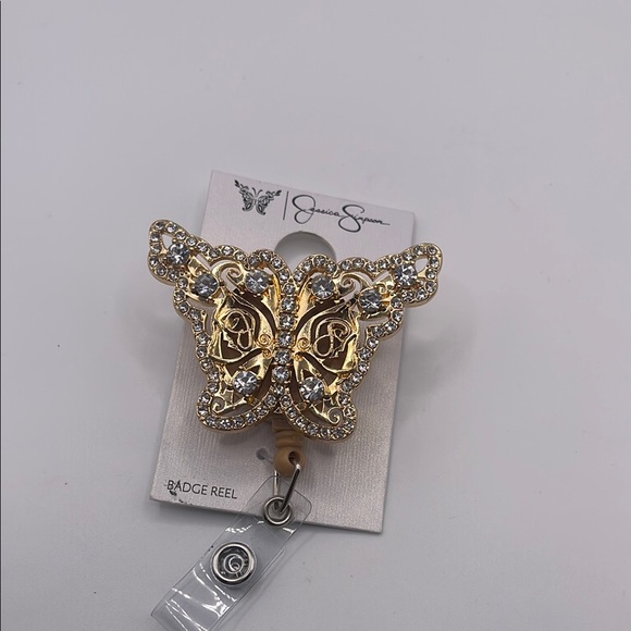 Jessica Simpson Gold and Silver Butterfly Badge Reel - Picture 1 of 5